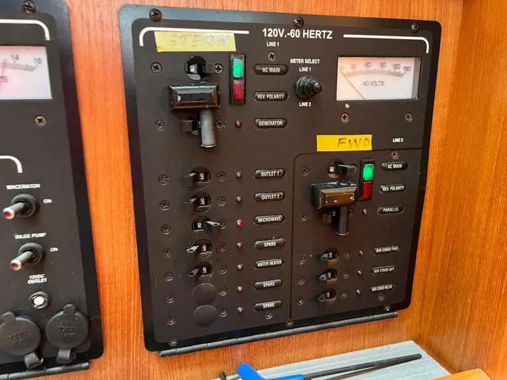  Yacht Photos Pics Electrical control panel on a 2004 Hunter 41 boat, featuring switches and voltage meters.