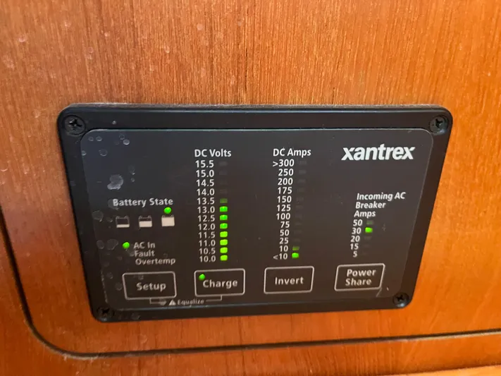  Yacht Photos Pics Xantrex power panel on 2004 Hunter 41 boat, displaying DC volts and amps.