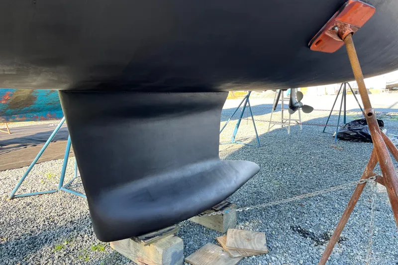 Tranquility Yacht Photos Pics 2016 Beneteau Oceanis 35 sailboat keel on dry dock, supported by stands.