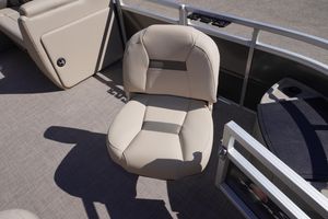 2024 Sun Tracker Fishin' Barge 20 DLX interior with beige seating and flooring.