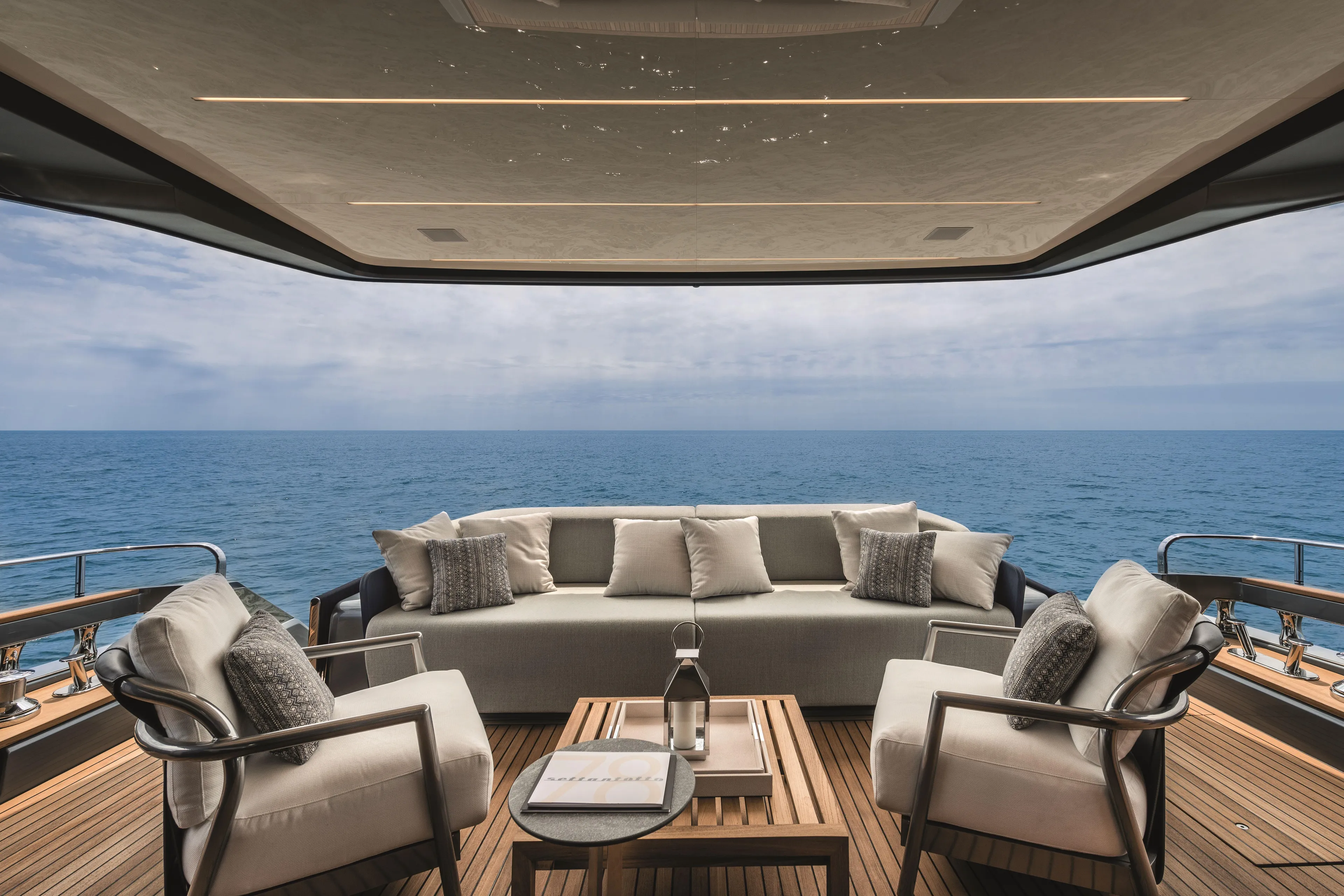  Yacht Photos Pics Luxurious 2026 Cranchi Settantotto 78 yacht deck with elegant seating and ocean view.