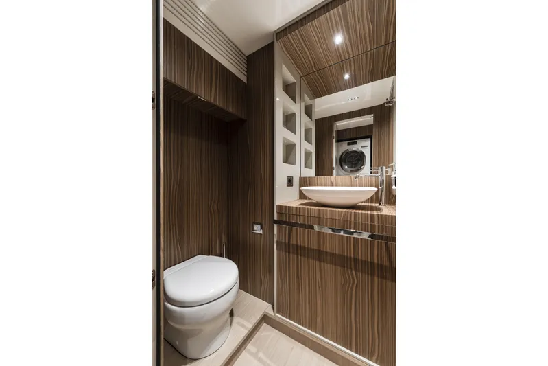  Yacht Photos Pics Luxurious bathroom in 2026 Cranchi Settantotto 78 yacht with modern wood finish.