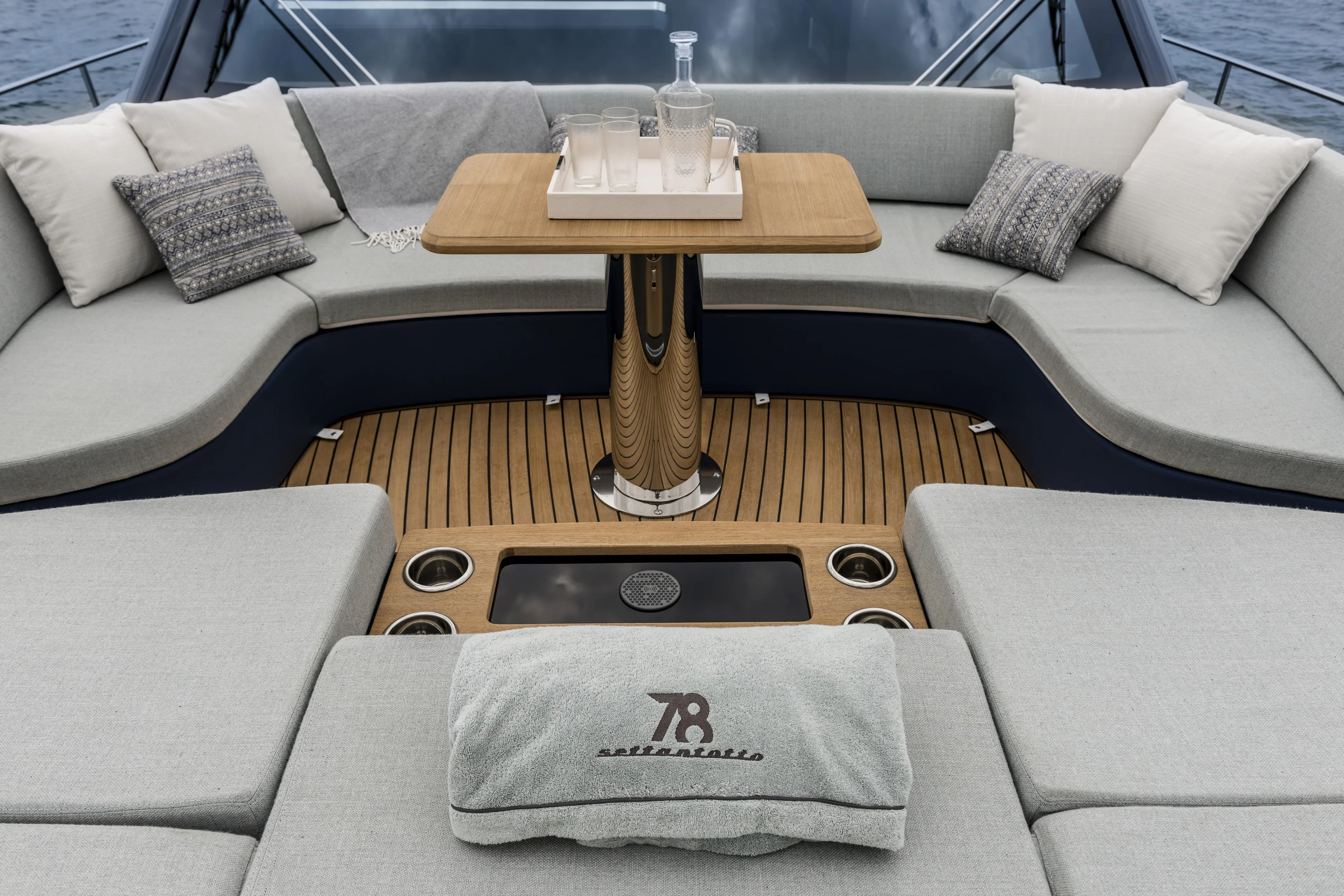  Yacht Photos Pics Luxurious seating area on 2026 Cranchi Settantotto 78 yacht with elegant cushions and table.