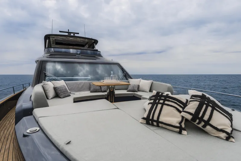  Yacht Photos Pics Luxurious 2026 Cranchi Settantotto 78 yacht deck with cushions and ocean view.
