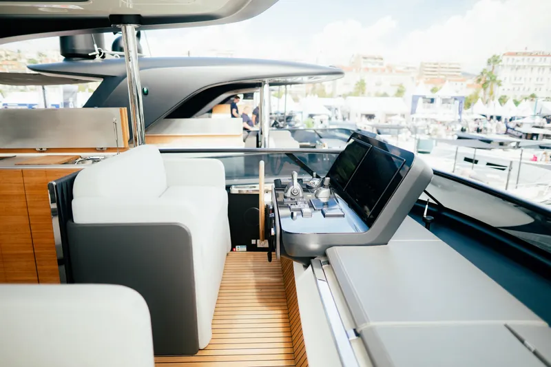  Yacht Photos Pics Luxurious helm of 2026 Cranchi Settantotto 78 yacht with modern controls and seating.