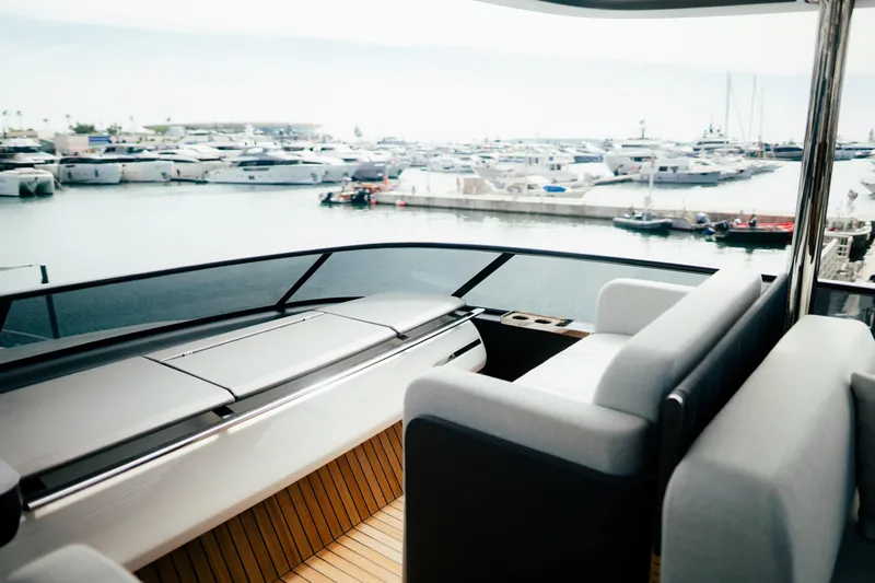  Yacht Photos Pics Luxurious 2026 Cranchi Settantotto 78 yacht interior overlooking marina with multiple boats.
