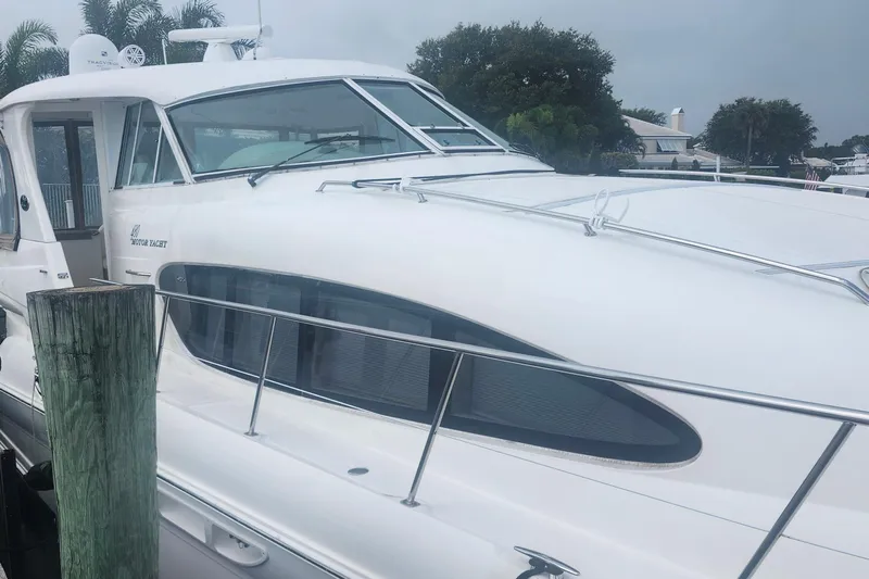  Yacht Photos Pics 2004 Sea Ray 480 Motor Yacht docked, showcasing sleek design and modern features.