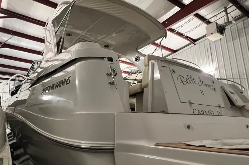 Belle Journee Yacht Photos Pics 2008 Four Winns V378 yacht in storage, rear view with "Belle Journée II" name.