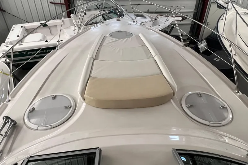 Belle Journee Yacht Photos Pics 2008 Four Winns V378 yacht deck with sunpad and hatches in storage.