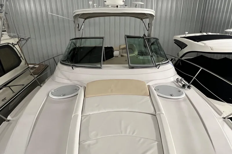 Belle Journee Yacht Photos Pics 2008 Four Winns V378 yacht in storage, featuring sleek design and spacious deck.