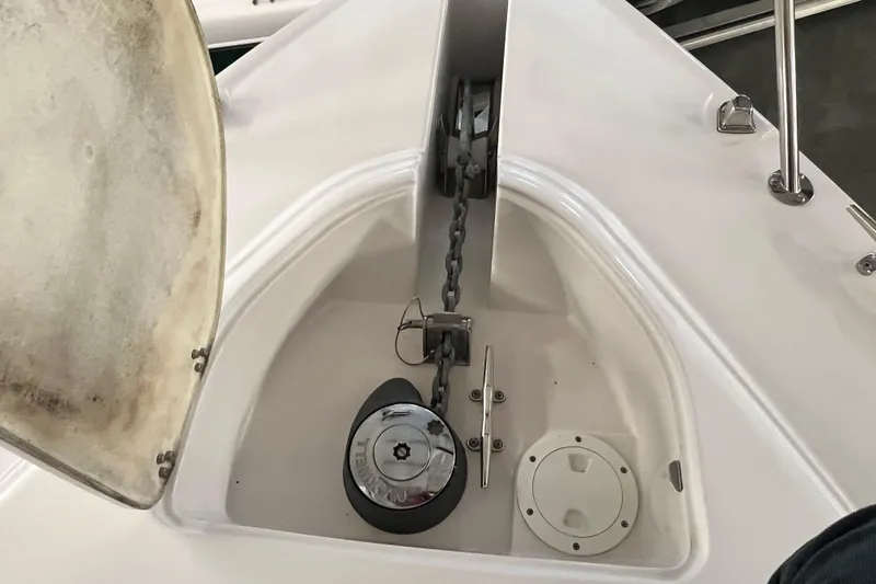 Belle Journee Yacht Photos Pics Anchor compartment of 2008 Four Winns V378 boat, featuring chain and winch.