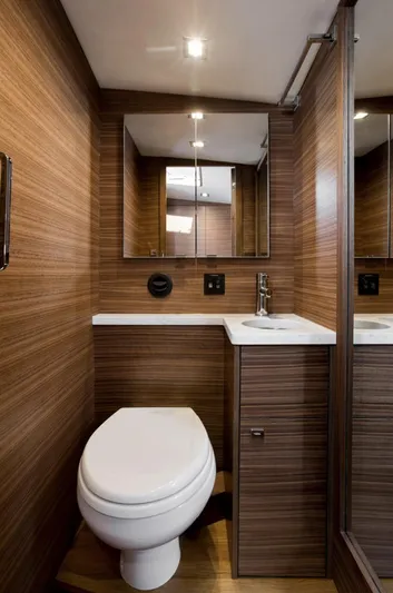 Nirvana Yacht Photos Pics Luxurious bathroom in 2020 Coastal Craft 33 Express yacht with modern wood paneling.