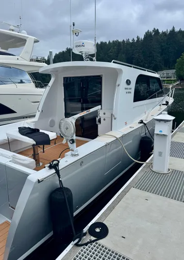 Nirvana Yacht Photos Pics 2020 Coastal Craft 33 Express docked, showcasing sleek design and modern features.