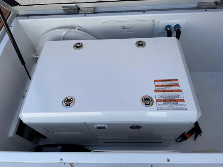 Nirvana Yacht Photos Pics Engine compartment of 2020 Coastal Craft 33 Express boat, featuring a white generator.