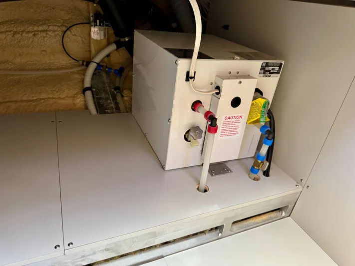 Nirvana Yacht Photos Pics Engine compartment of 2020 Coastal Craft 33 Express boat, featuring mechanical components and wiring.