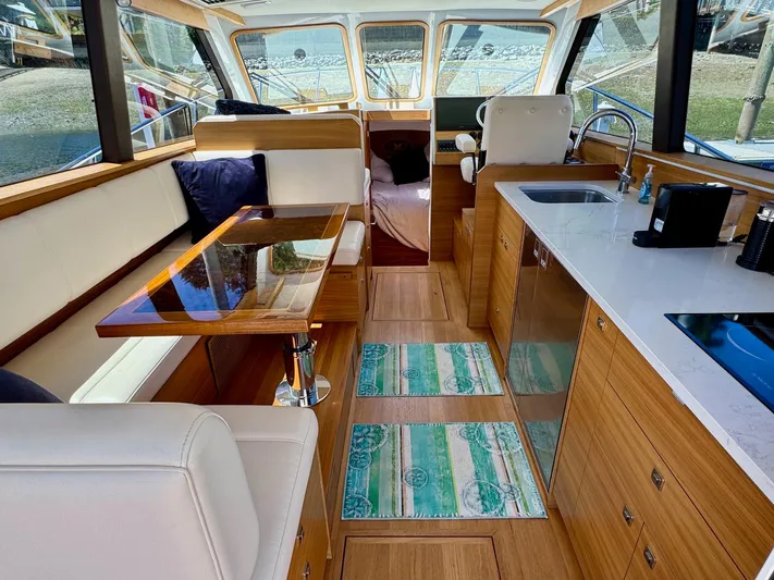Nirvana Yacht Photos Pics Interior of 2020 Coastal Craft 33 Express yacht with modern kitchen and seating area.
