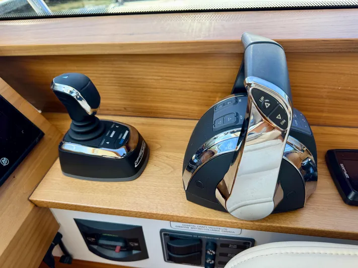 Nirvana Yacht Photos Pics 2020 Coastal Craft 33 Express control panel with joystick and throttle levers.