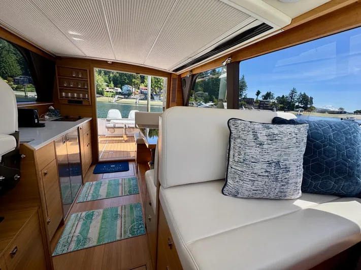 Nirvana Yacht Photos Pics Interior of 2020 Coastal Craft 33 Express yacht with elegant seating and scenic view.