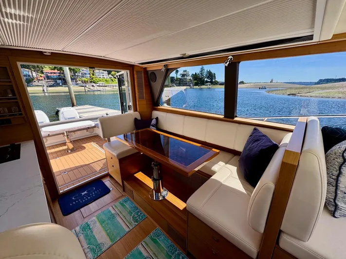 Nirvana Yacht Photos Pics Interior of 2020 Coastal Craft 33 Express yacht with elegant seating and scenic water view.