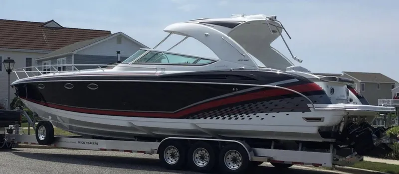  Yacht Photos Pics 2015 Formula 400 FX8 boat on a trailer in a residential area.