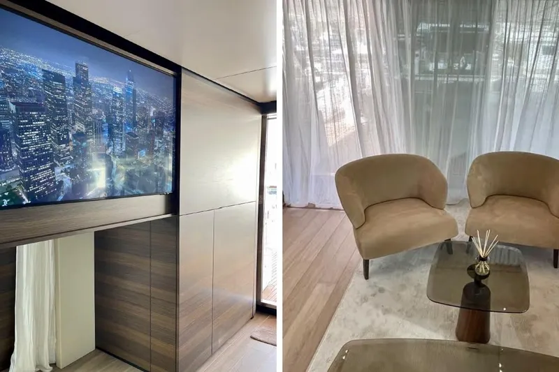 Lumpasaurus Yacht Photos Pics Luxurious interior of 2023 Custom Line Navetta 33 yacht with modern decor and cityscape view.