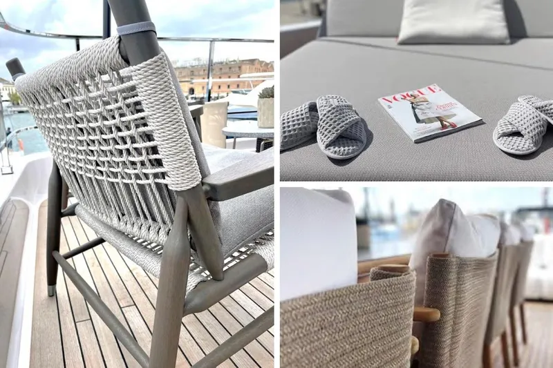 Lumpasaurus Yacht Photos Pics Luxurious 2023 Custom Line Navetta 33 yacht interior with woven chair, slippers, and magazine.