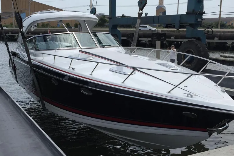  Yacht Photos Pics 2015 Formula 400 FX8 boat being lifted from water by crane.