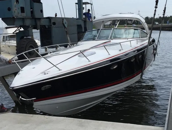  Yacht Photos Pics 2015 Formula 400 FX8 boat being lifted from the water at a marina.