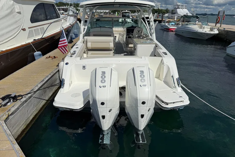  Yacht Photos Pics 2022 Boston Whaler 320 Vantage docked, featuring dual Mercury 300 V8 engines.