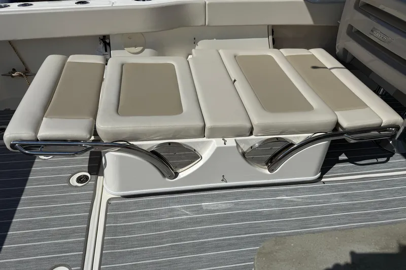  Yacht Photos Pics 2022 Boston Whaler 320 Vantage boat seating with cushioned bench and sleek design.