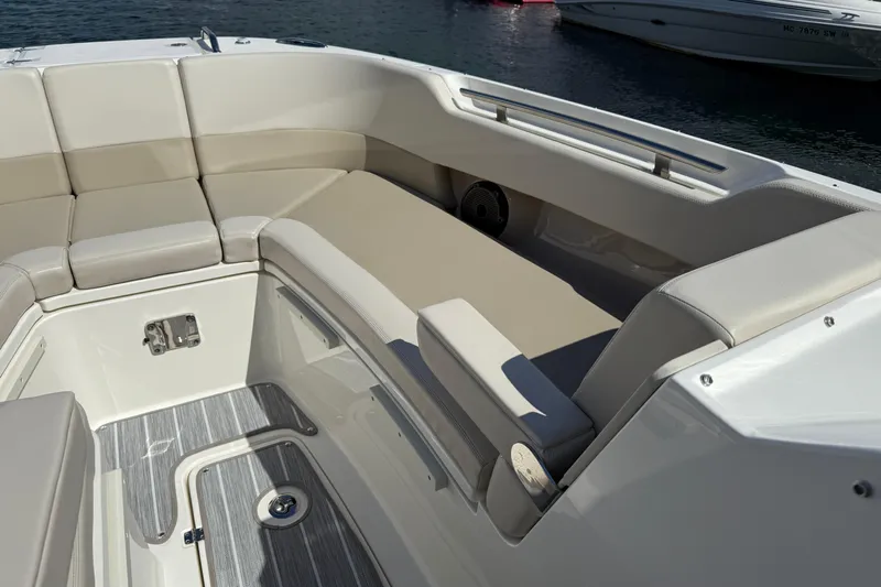  Yacht Photos Pics 2022 Boston Whaler 320 Vantage boat interior with cushioned seating and sleek design.