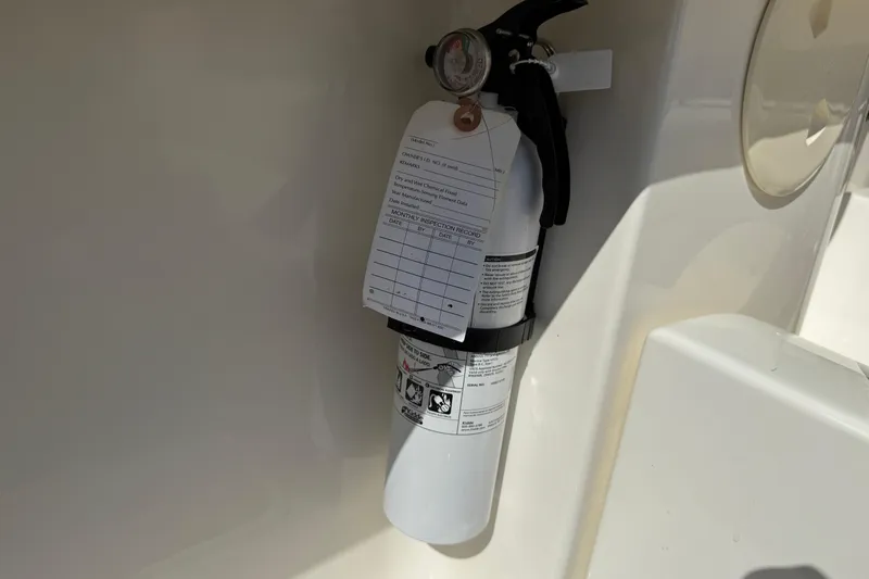  Yacht Photos Pics Fire extinguisher mounted on 2022 Boston Whaler 320 Vantage boat interior.