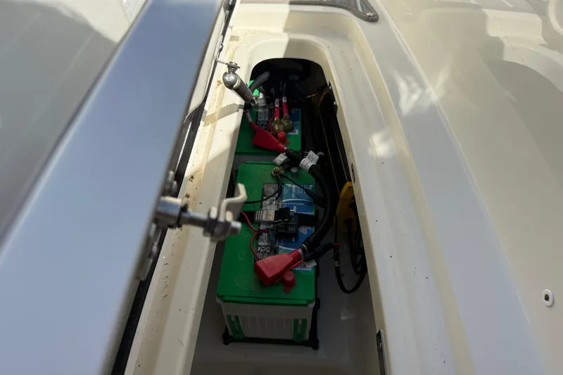  Yacht Photos Pics Battery compartment of a 2022 Boston Whaler 320 Vantage boat, showing wiring and connections.
