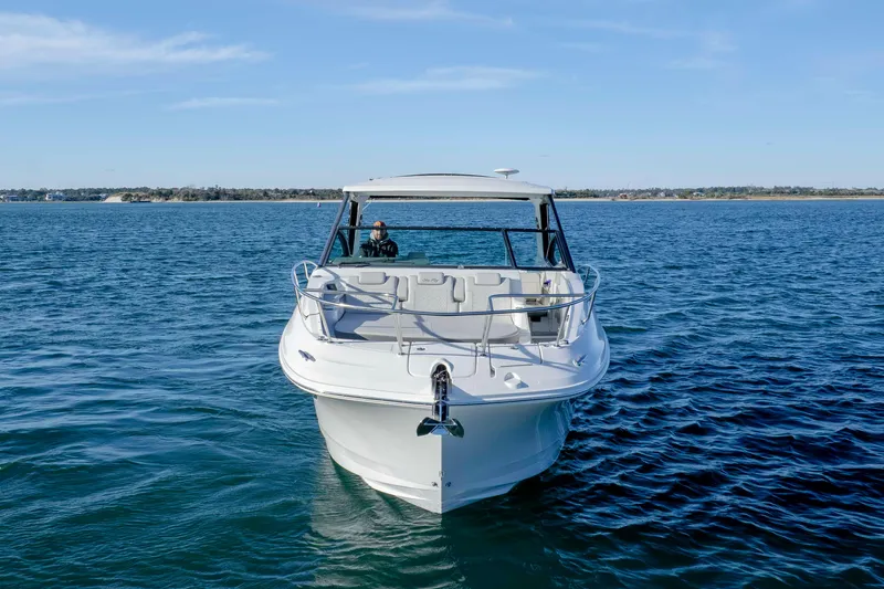  Yacht Photos Pics 2020 Sea Ray Sundancer 320 Outboard cruising on open water under clear skies.