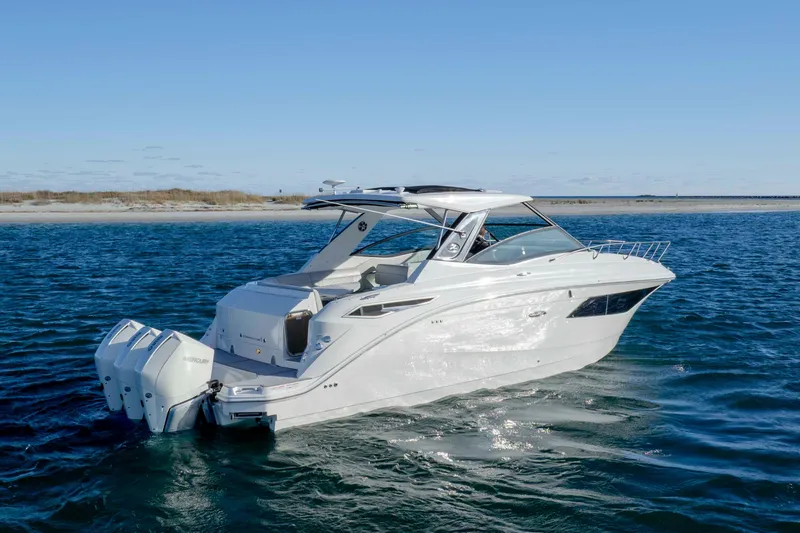  Yacht Photos Pics 2020 Sea Ray Sundancer 320 Outboard cruising on open water under clear skies.