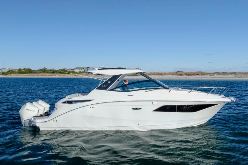  Yacht Photos Pics 2020 Sea Ray Sundancer 320 Outboard cruising on open water under clear skies.