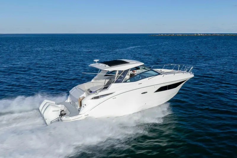  Yacht Photos Pics 2020 Sea Ray Sundancer 320 Outboard cruising on open water, showcasing sleek design and performance.