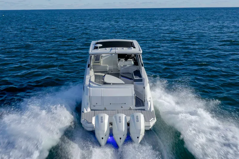  Yacht Photos Pics 2020 Sea Ray Sundancer 320 Outboard cruising on open water, rear view.