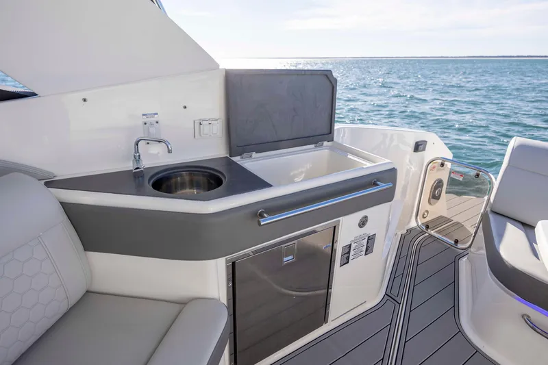  Yacht Photos Pics 2020 Sea Ray Sundancer 320 Outboard interior with kitchenette and ocean view.