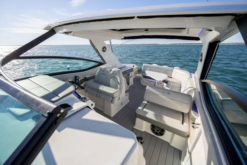  Yacht Photos Pics 2020 Sea Ray Sundancer 320 Outboard boat interior with luxurious seating on open water.