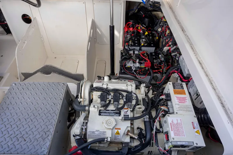 Yacht Photos Pics Engine compartment of 2020 Sea Ray Sundancer 320 Outboard with visible wiring and components.