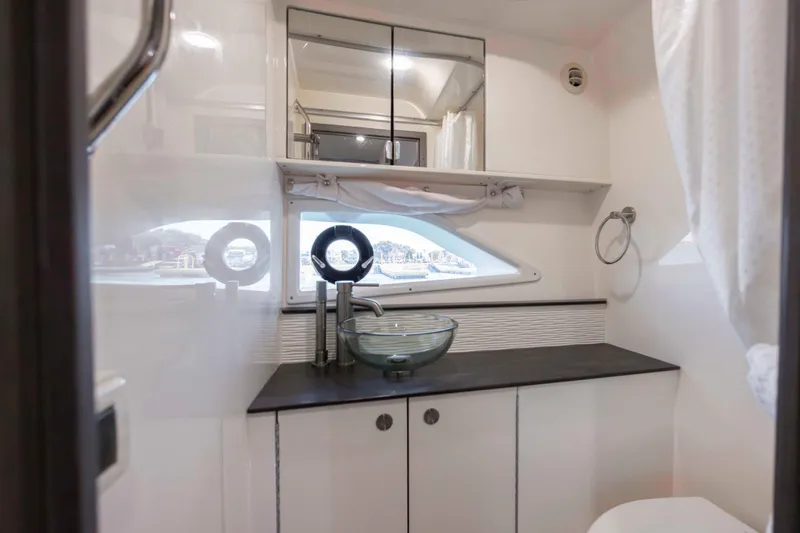  Yacht Photos Pics 2020 Sea Ray Sundancer 320 Outboard bathroom with modern sink and mirror.