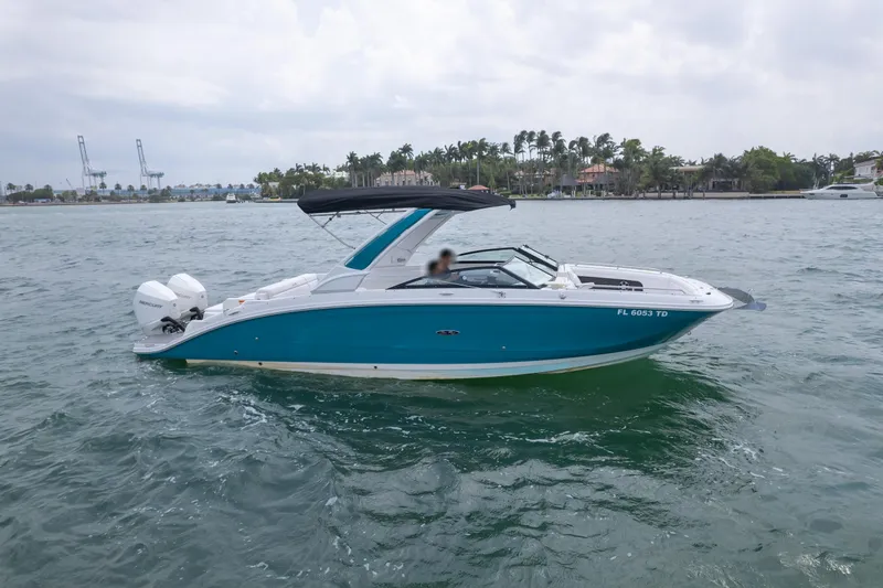  Yacht Photos Pics 2022 Sea Ray SDX 290 Outboard boat cruising on a scenic waterway.