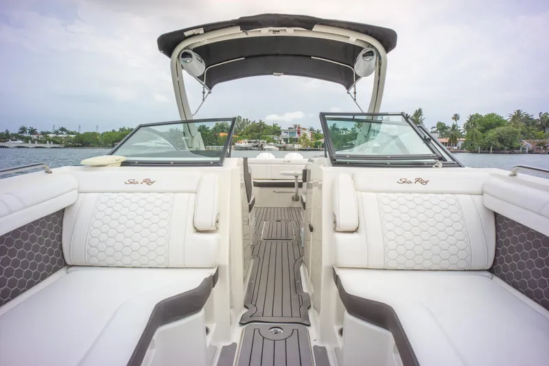 Yacht Photos Pics 2022 Sea Ray SDX 290 Outboard boat interior with luxurious seating and sleek design.