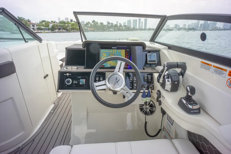  Yacht Photos Pics 2022 Sea Ray SDX 290 Outboard helm with modern controls and navigation system.