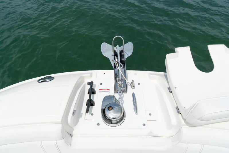  Yacht Photos Pics 2022 Sea Ray SDX 290 Outboard boat anchor system on deck, with ocean background.