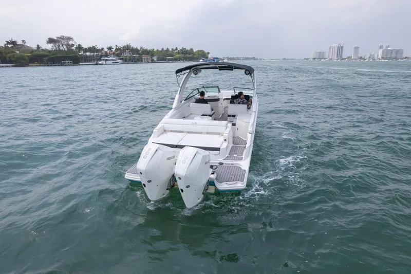 Yacht Photos Pics 2022 Sea Ray SDX 290 Outboard cruising on open water, showcasing dual engines.