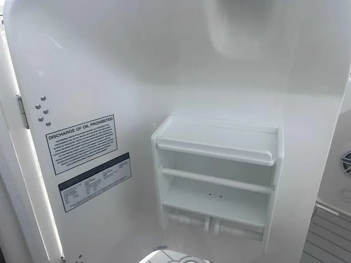 Black Label Marine Yacht Photos Pics Interior of 2026 Sea Fox 288 Traveler boat with storage shelves and safety notice.