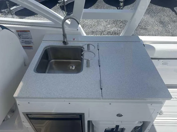 Black Label Marine Yacht Photos Pics 2026 Sea Fox 288 Traveler boat kitchenette with sink and countertop.