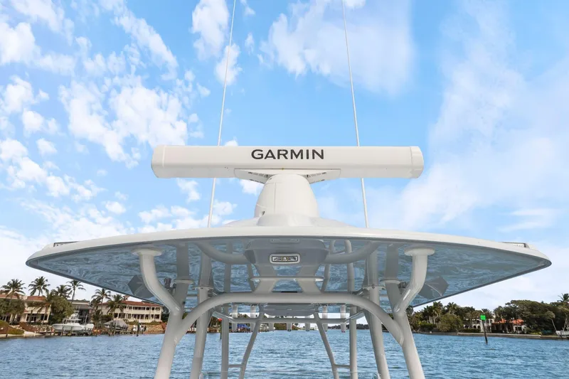  Yacht Photos Pics 2026 Yellowfin 32 Offshore boat with Garmin radar, clear sky background.